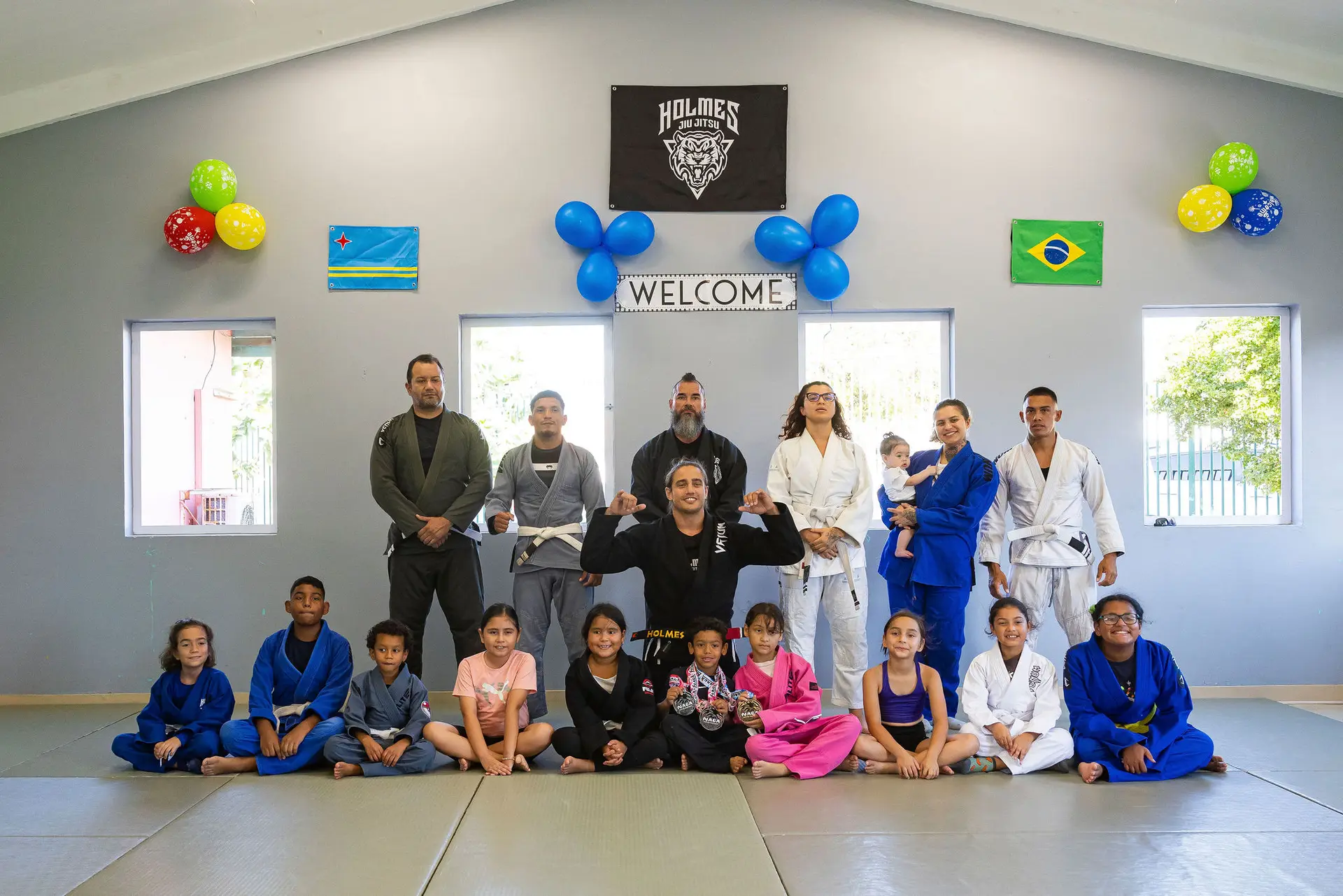 The Holmes Jiu Jitsu team and family on the mat in Aruba